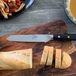 Alpha-Royal Japanese Serie 5,5" Allzweckmesser Wellen Damast-Stahl -Haushaltsgeräte 10038997 de 0003 logo